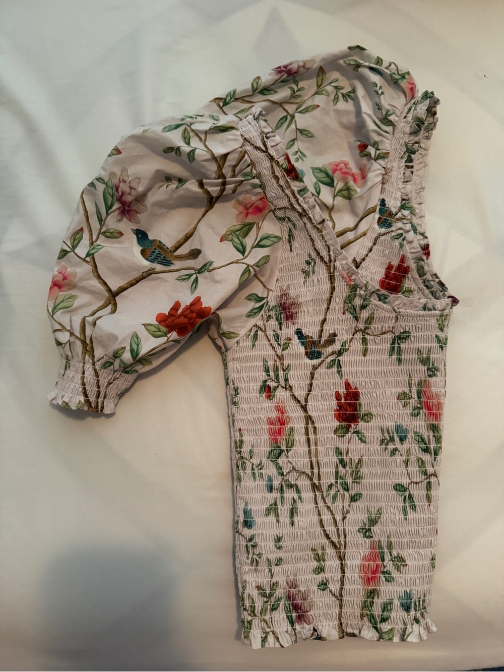 Hill House pink label smocked top with pastel floral accents
